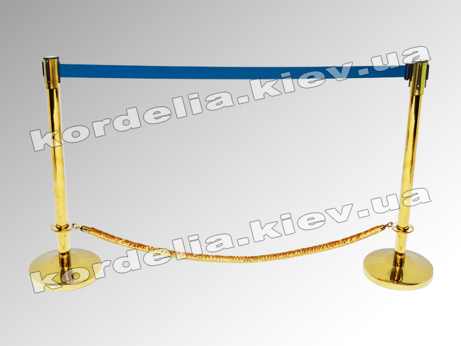 Golden fence with blue-and-yellow merchandise under the flag of Ukraine